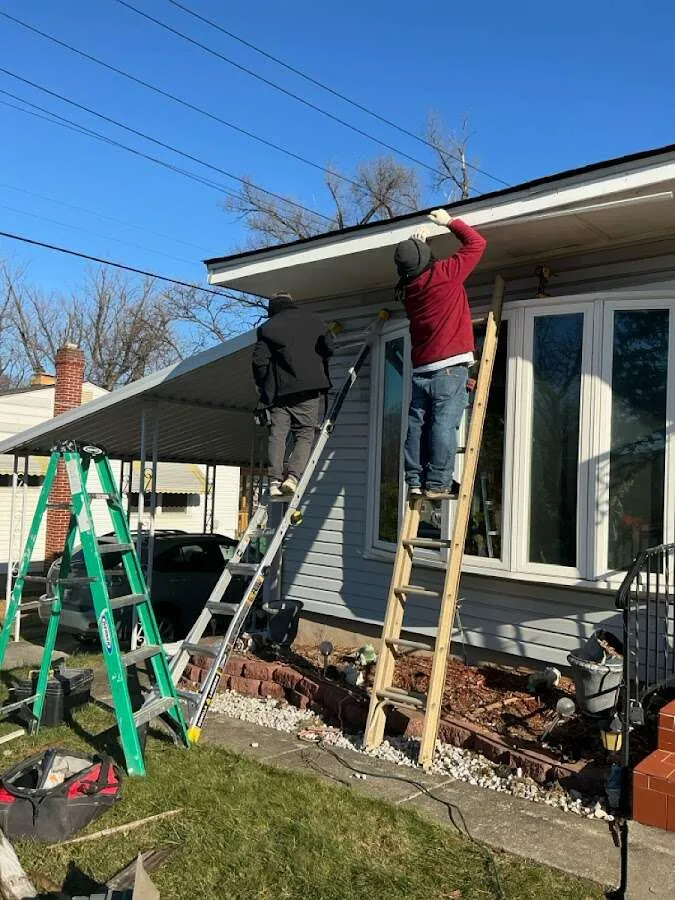 Restoration crew performing exterior repair in Raisin